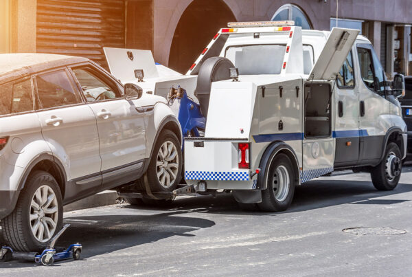 Do You Own a Towing Company? This is the Right Place for You! - Tow Truck Carrying a SUV